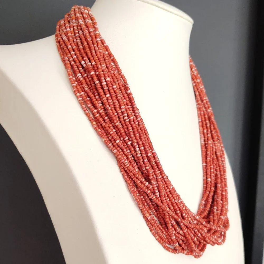 Orange and white multi strand seed bead necklace